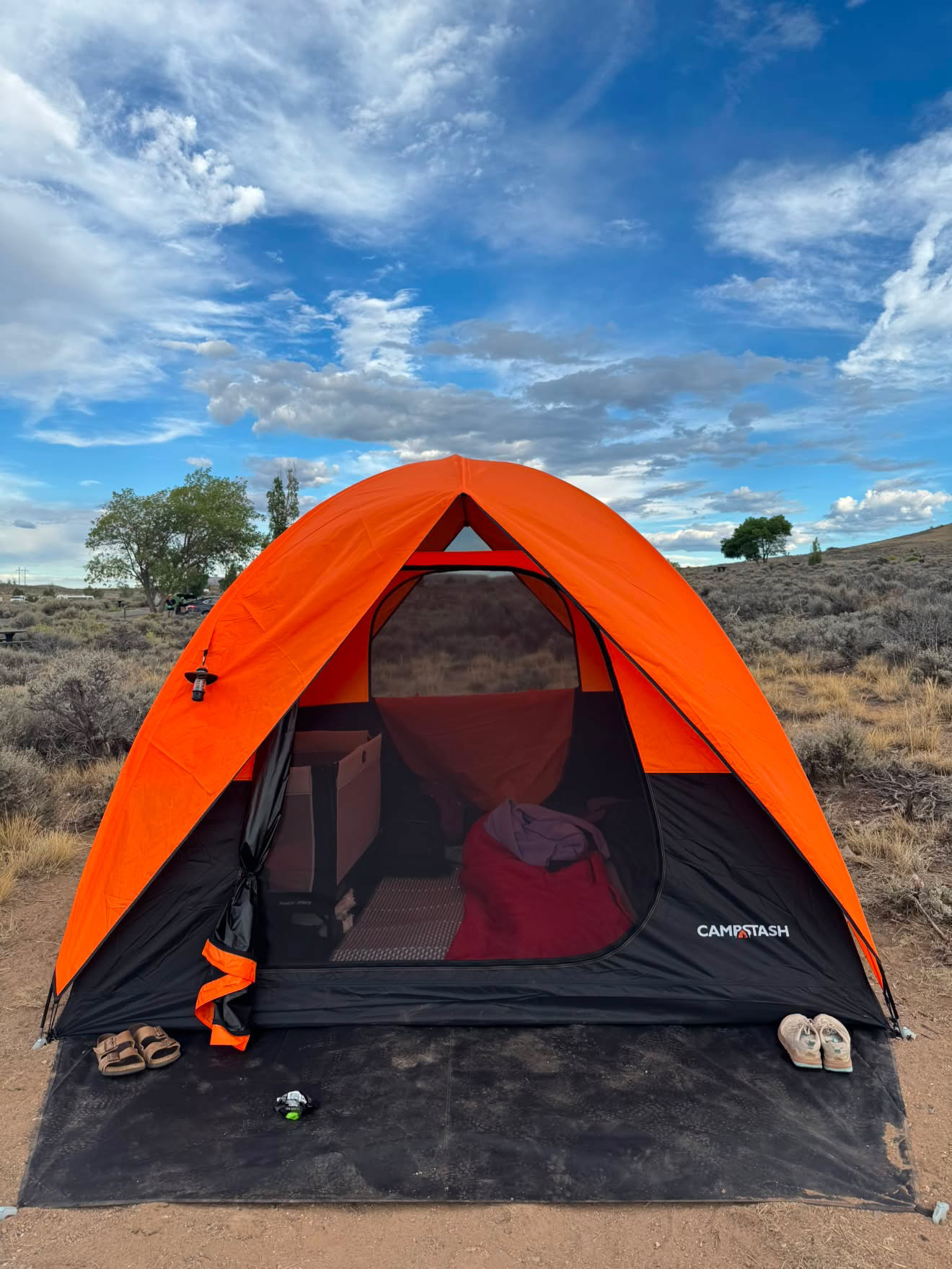 Angele's Campstash Tent set up beneath a wide blue sky at a Colorado campsite
