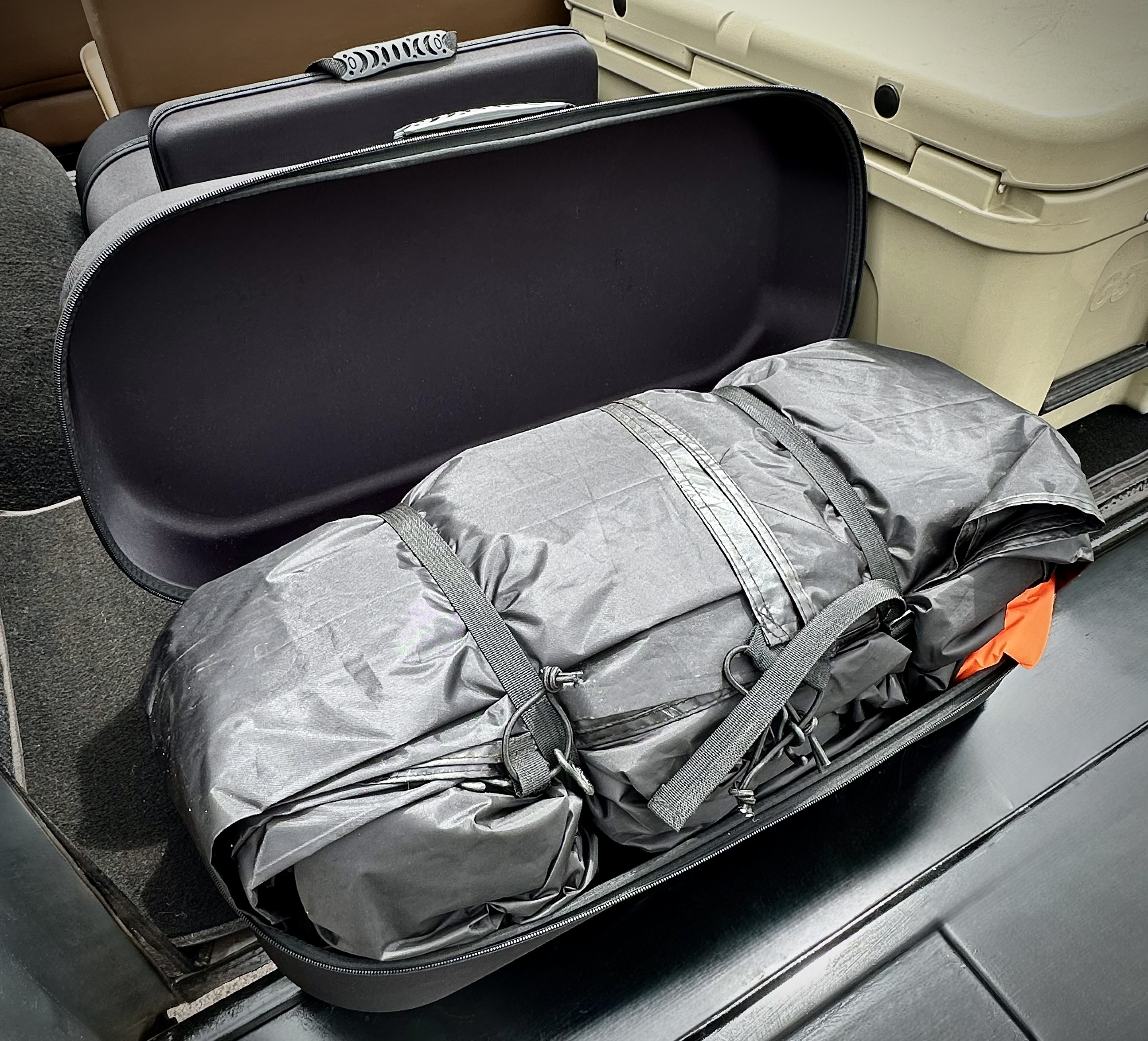 Campstash hard case open with tent packed inside