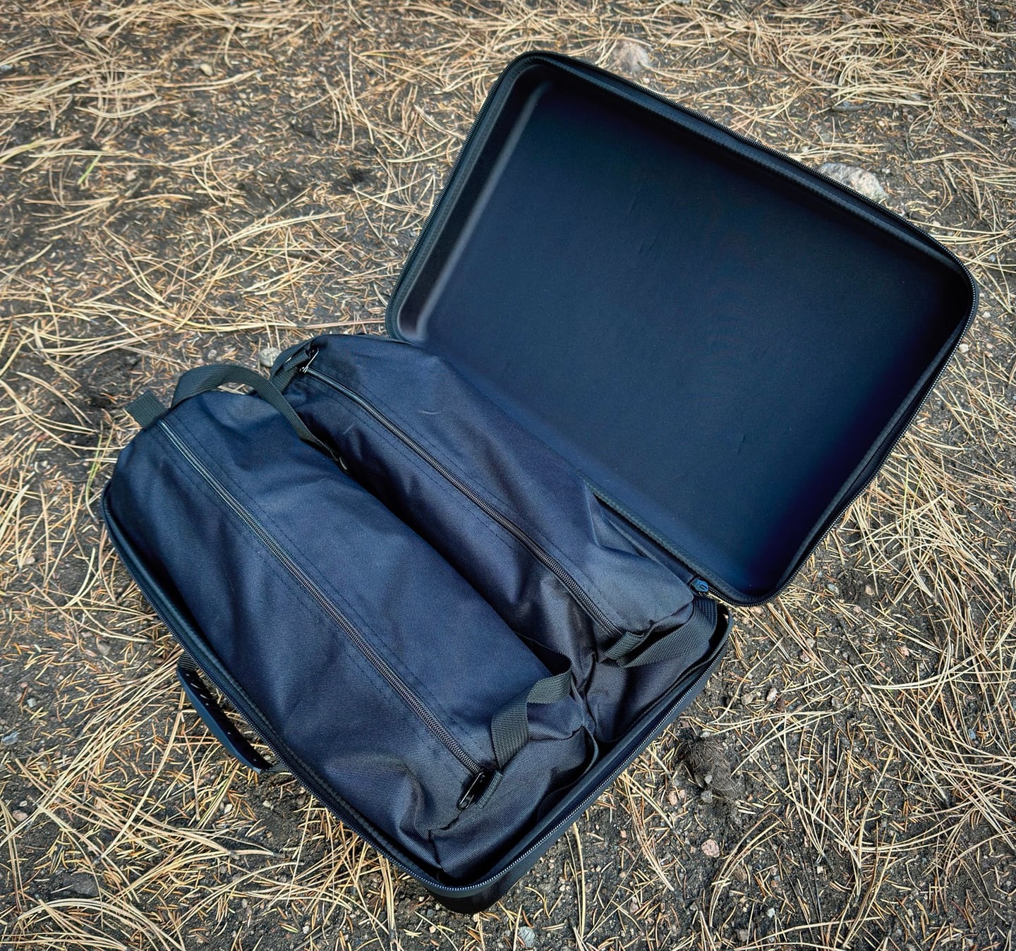 Two Campstash chairs packed inside the open carrying case