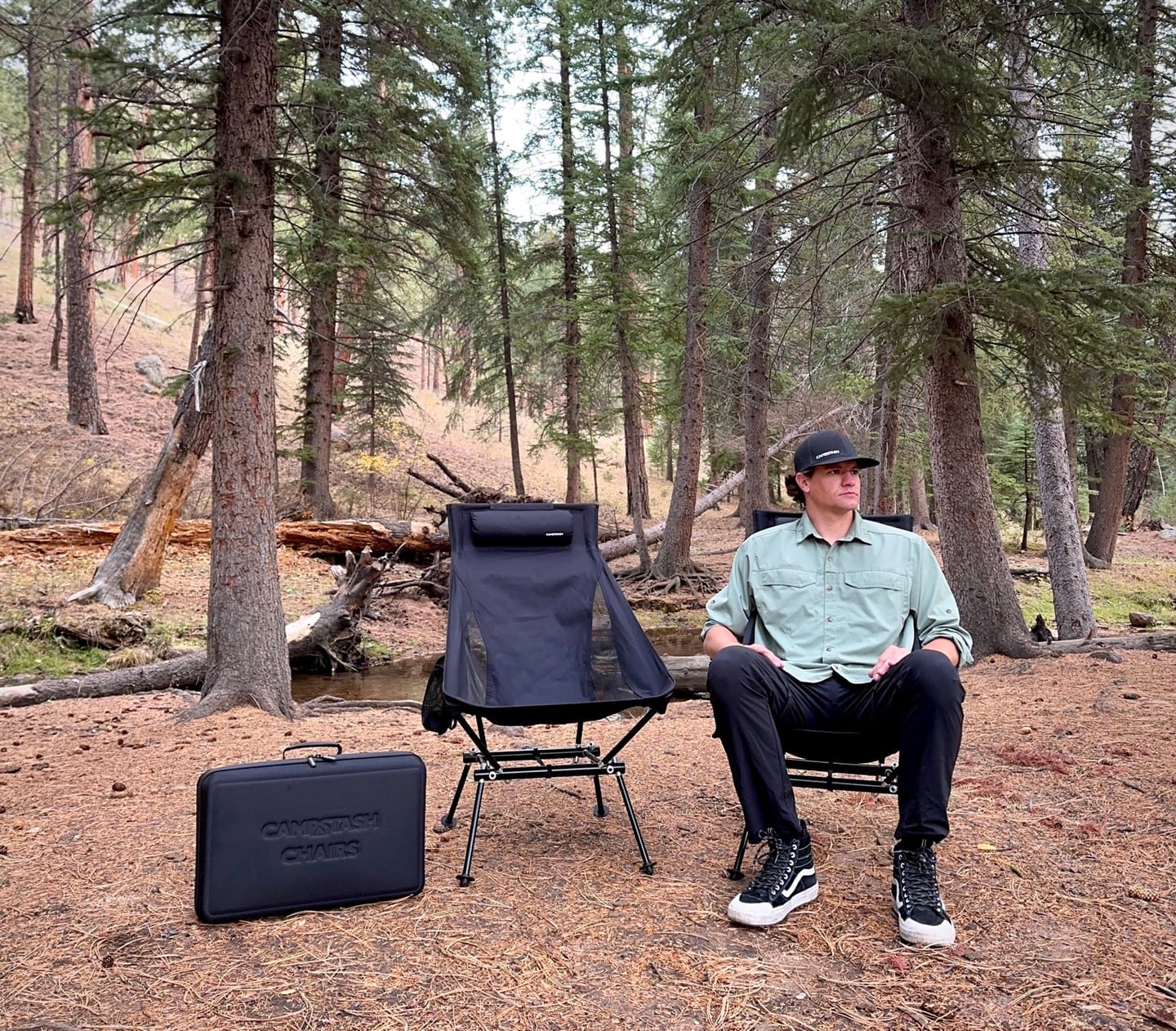 Person seated in a Campstash chair showing the chair's proportions